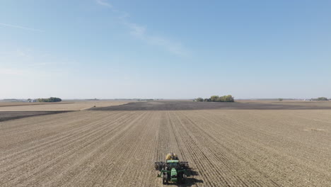 Aerial,-Tractor-Strip-Tilling-Farm-Field-to-Prepare-For-Seeding