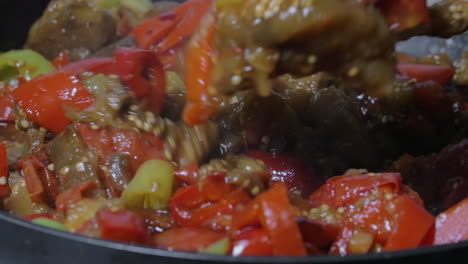 stirring vegetables stewing in the frying pan