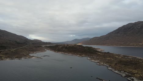 Beautiful-view-of-lake-landscape-surrounded-by-mountains-in-the-Scottish-Highlands