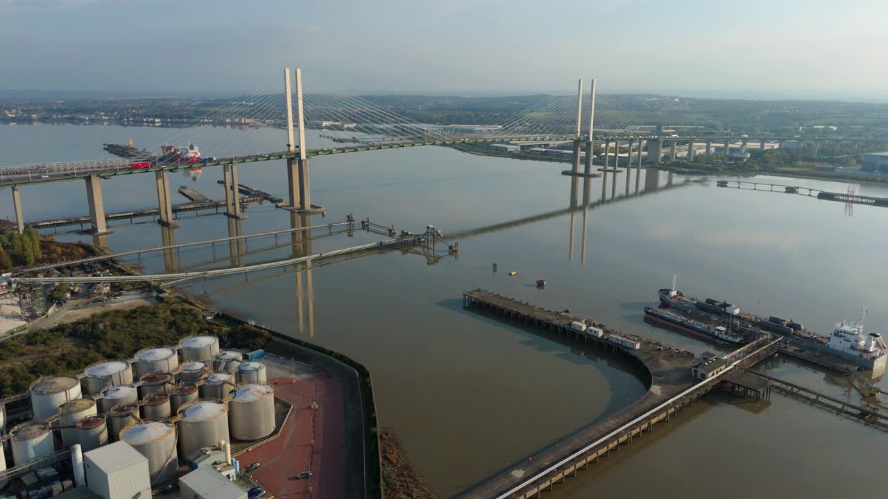 Drone Footage of Busy Industrial Port With River Thames Bridges Including Queen Elizabeth and Dartford Tunnel at Late Evening London UK