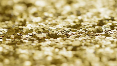 macro sliding view of gold glitter