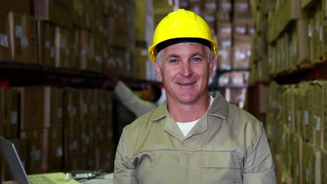 warehouse worker smiling at camera