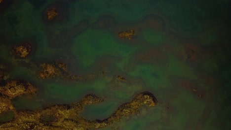 Aerial-view-over-natural-textures-and-patterns-of-the-Icelandic-highlands-terrain-and-water-ponds