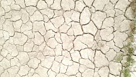 Bird's-eye-view-of-severe-drought,-desertification-process,-cracked-soil