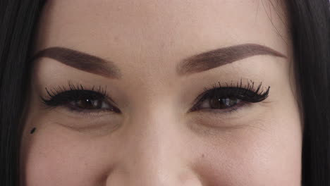 close-up-hispanic-woman-eyes-wearing-makeup-looking-at-camera-beauty-cosmetics