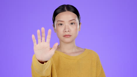 stop, hands and face of asian woman in studio