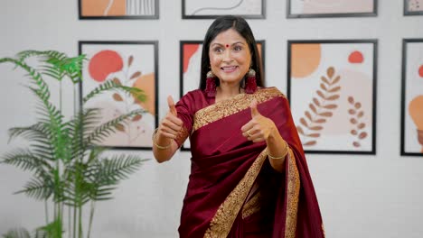 Indian-woman-pointing-downwards-at-Copy-space