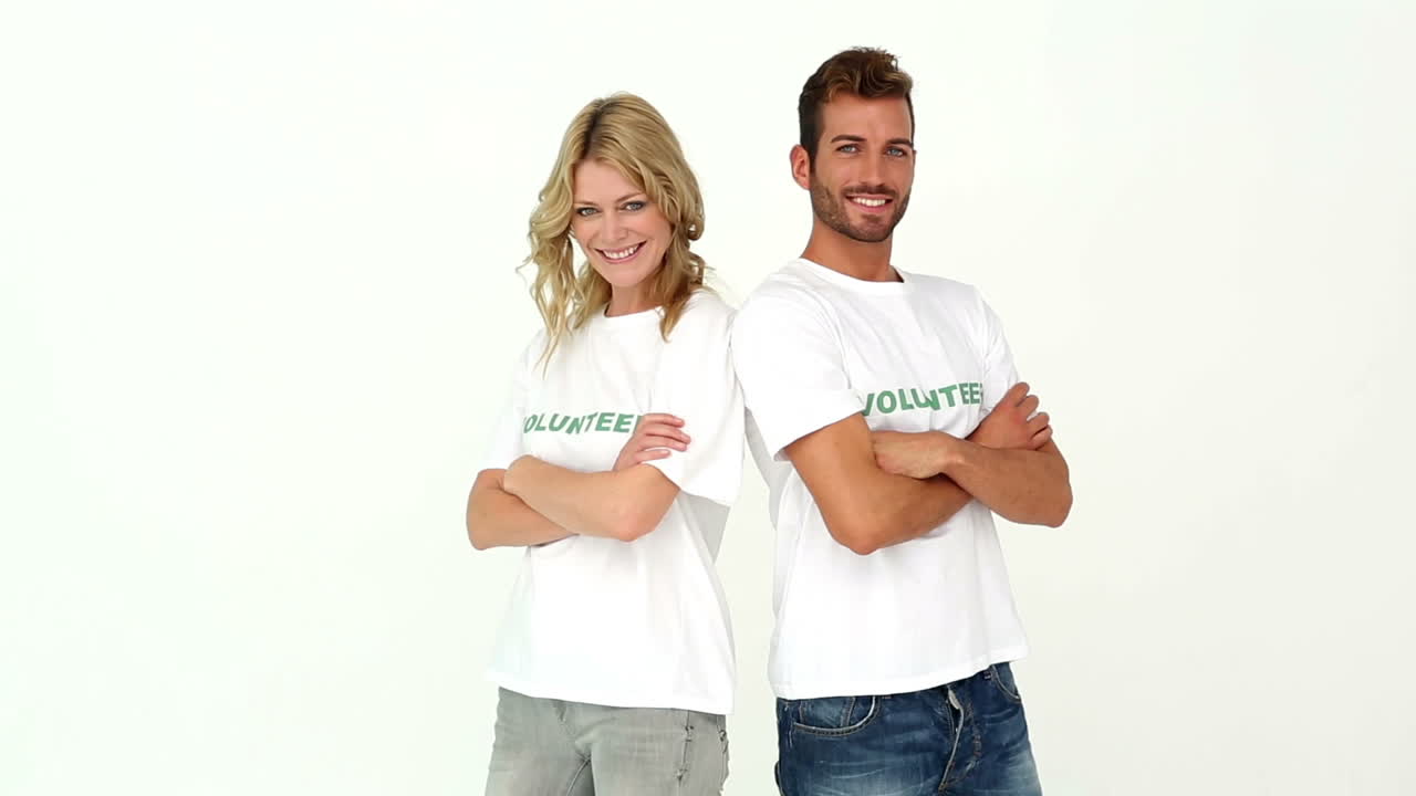 Two volunteers smiling at camera