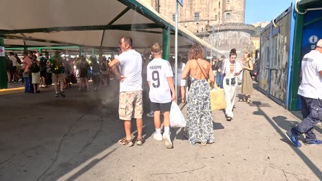 people walking through a busy outdoor market