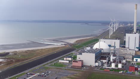 Aerial-hot-of-a-nuclear-power-plant-on-the-coast-of-the-sea-in-the-Netherlands