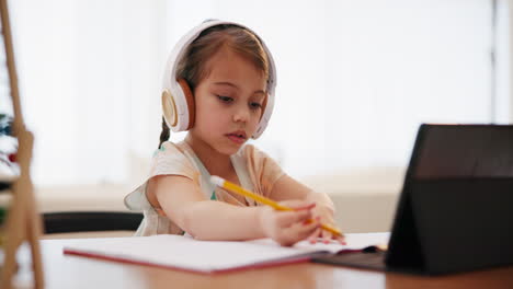 Writing,-homework-and-girl-with-tablet