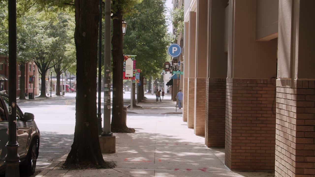 City Street Scene with Parking and Surveillance Signs