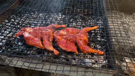 chicken tikka in preparation in road side dhaba in india