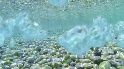 underwater texture loop with stones and particles