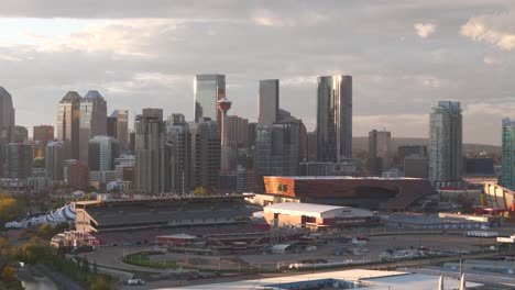 An-aerial-drone-captures-the-Calgary-Stampede-grounds-and-race-track-with-the-downtown-core-and-tower-in-the-background