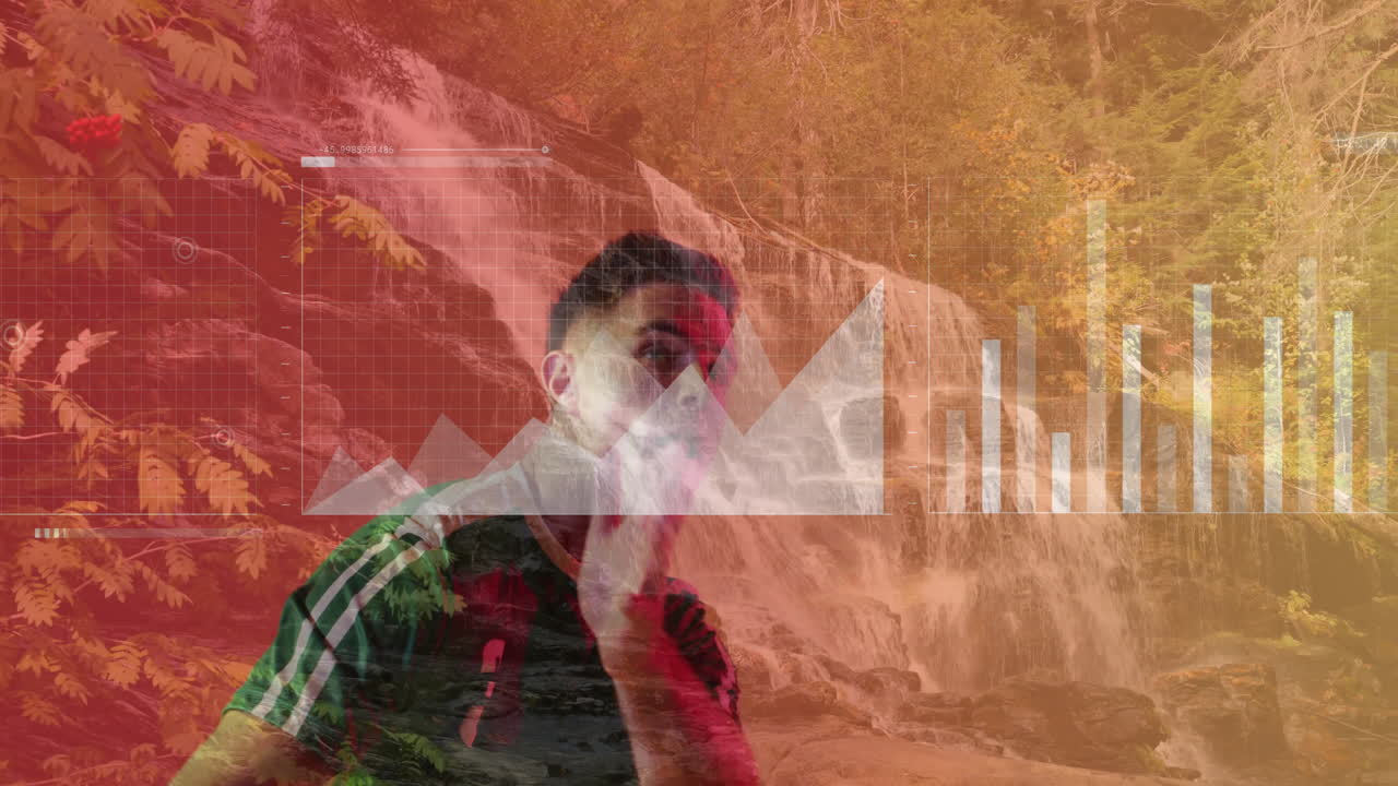 Gesturing over financial graphs, man viewing animation of nature scene outdoors