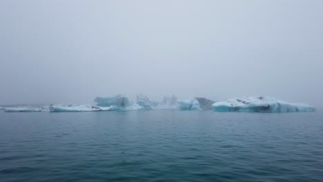 groups of icebergs floating in jokusarlon glacier lagoon in south iceland