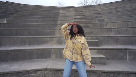 black woman listening to music and dancing