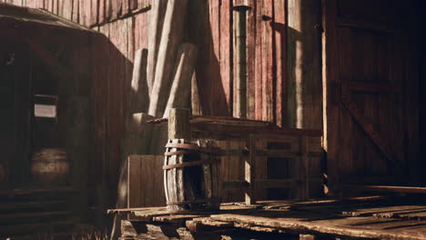 rustic old barn with wooden barrel