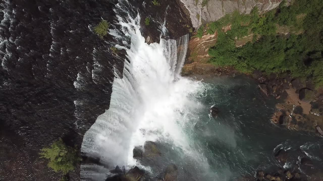 Top Down Drone Aerial View of Laja Falls, Chile. Majestic Waterfall With Alpine River Water