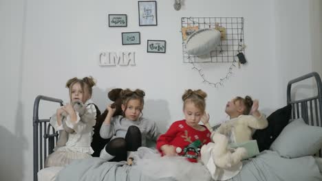 Adorable Little Children Rejoice in the Holy Christmas Merry Christmas and Happy Holidays Merry Christmas and Happy Holidays Adorable Little Children Make Cards Gifts and Decorations for the Holiday Cute Kids are Engaged in Creativity Sisters with New Year Gifts