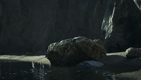 rugged rock cliff with mountains in the ocean