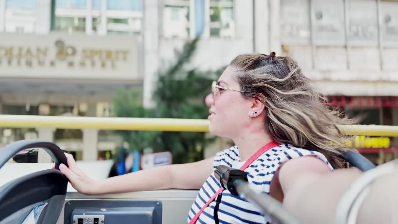 Woman Vlogging Her City Tour from an Open-Top Bus, Athens, Greece
