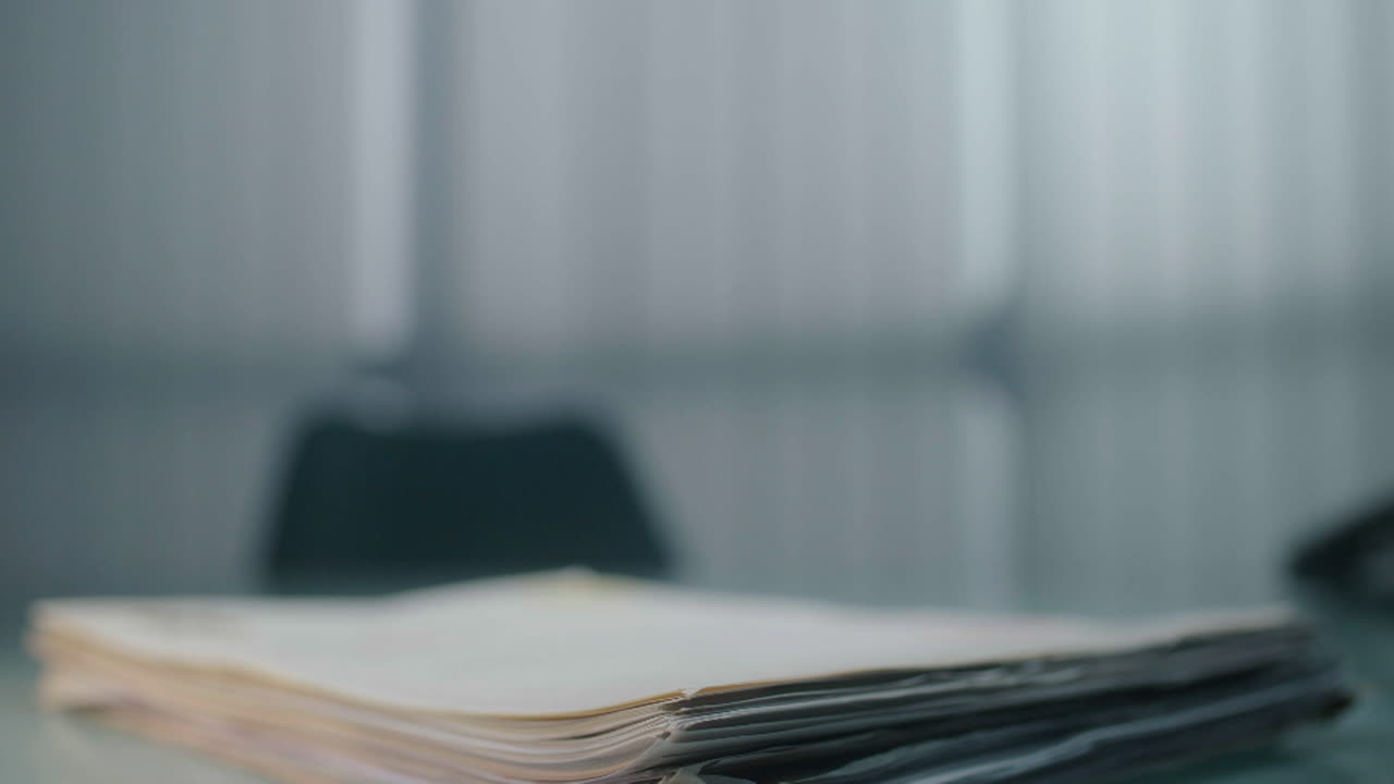 Stack of Papers on a Desk
