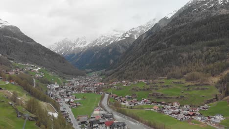 drone shot of a small town in the austrian alps - sölden, austria