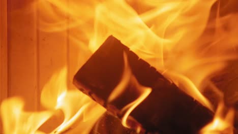 Close-up-shot-of-Burning-Flame-At-Fireplace-on-wooden-logs