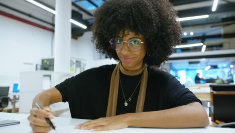 young african-american businesswoman talking on web call in office
