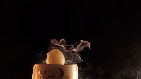 blowing on christmas candle at slow motion