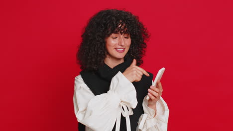 woman using smartphone showing pointing on phone, advertising web application, positive feedback