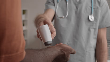 unrecognizable nurse measuring temperature of patient