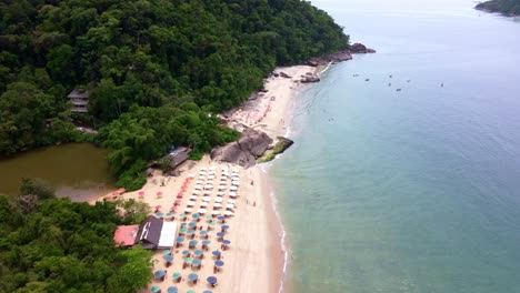 Aerial-flying-over-coast-of-Ubatuba-at-sunset,-Brazil