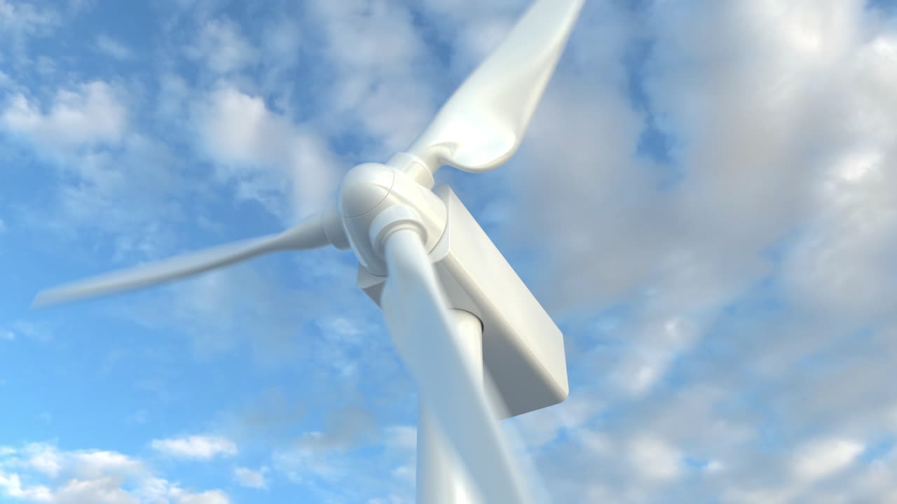 구름이 가득한 하늘을 배경으로 회전하는 풍력 터빈의 클로즈업