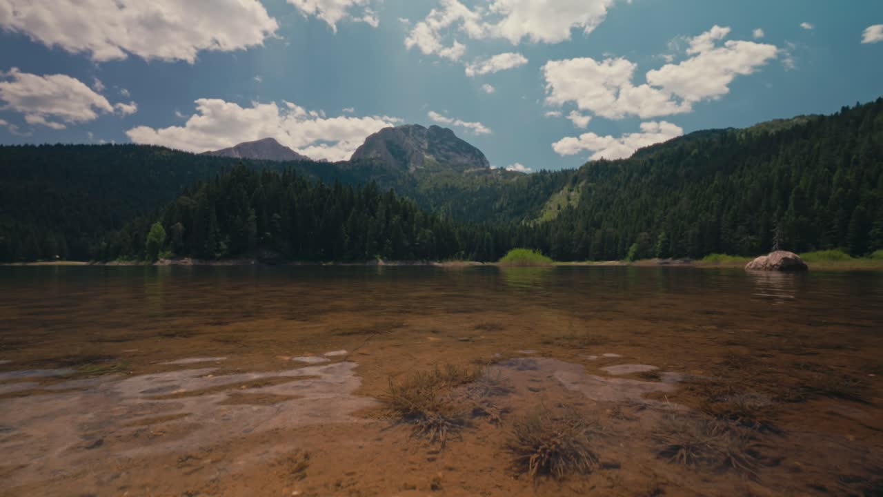 Scenic Black Lake in Montenegro's Durmitor Park under a serene sky