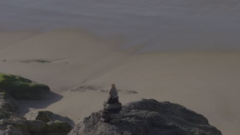 soft ocean waves gently roll up a smooth sandy beach, capturing the peaceful rhythm of the tide.