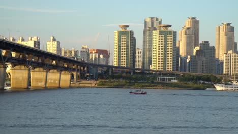 cheongdam bridge with golden hour sunlight illuminating skyscrapers on riverbank