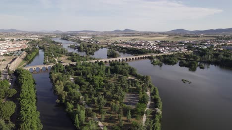 unesco heritage puente romano spanning mirror-like river