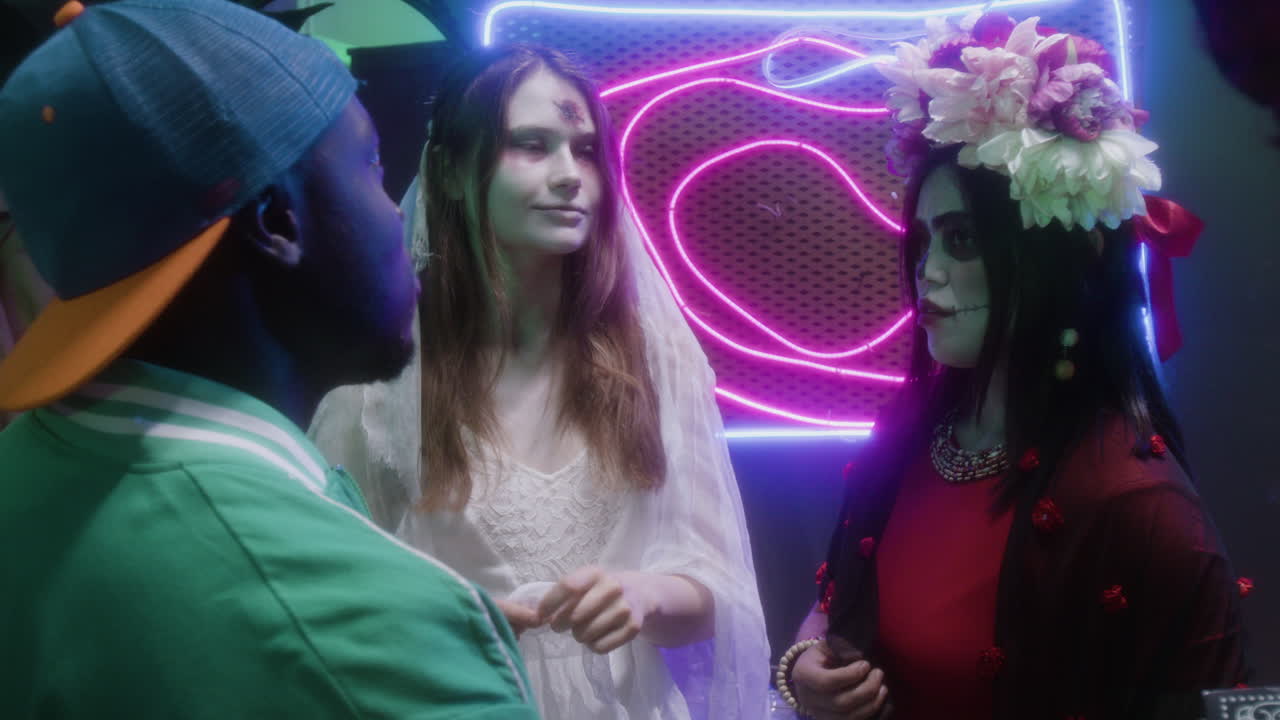 Halloween party with neon lights and costumes