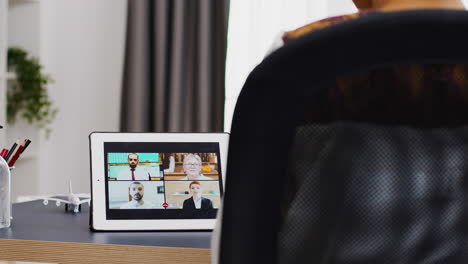 Woman-talking-with-her-colleagues-during-a-video-call