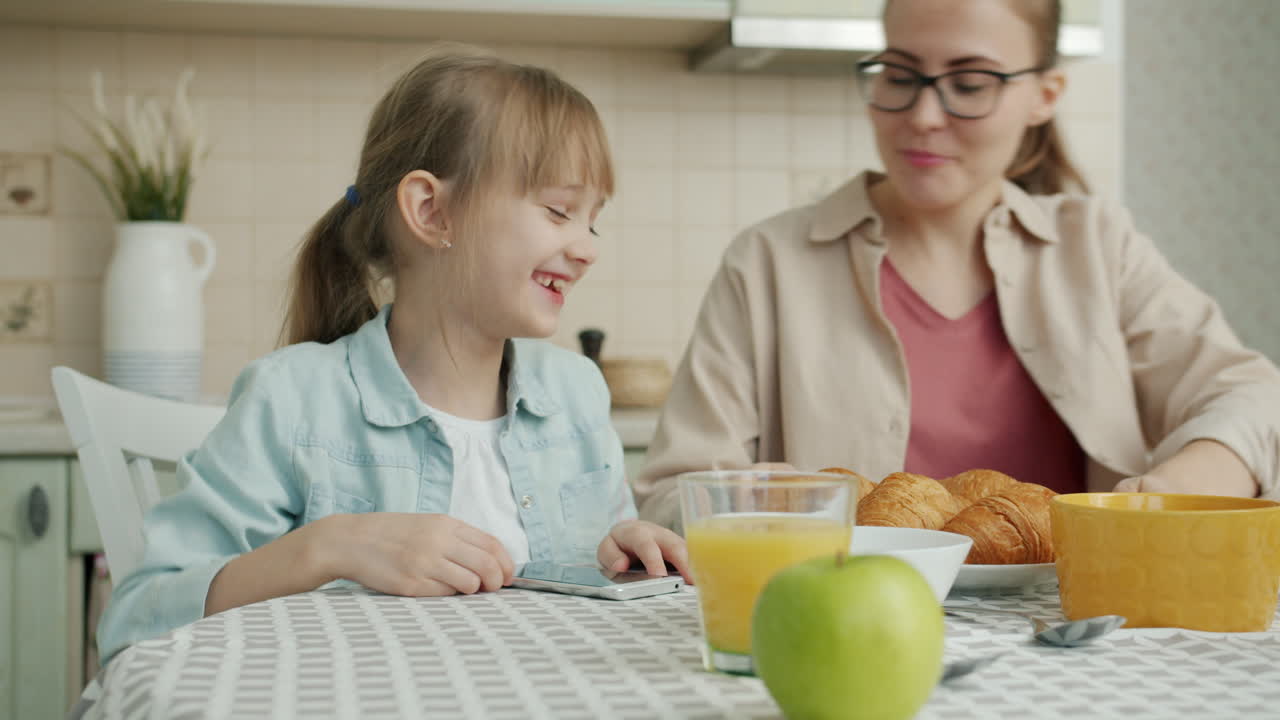 Daughter and Mother Enjoying Breakfast Together