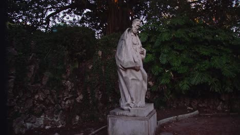 statue of a man , looking down on a secret park