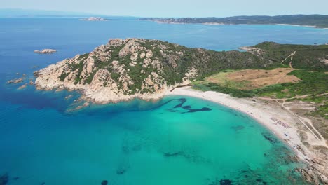 monti russu beach and cove at costa paradiso, sardinia, italy - cinematic aerial 4k