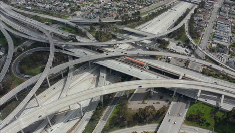 AERIAL:-Spectacular-Judge-Pregerson-Interchange-showing-multiple-Roads,-Bridges,-Highway-with-little-car-traffic-in-Los-Angeles,-California-on-Beautiful-Sunny-Day