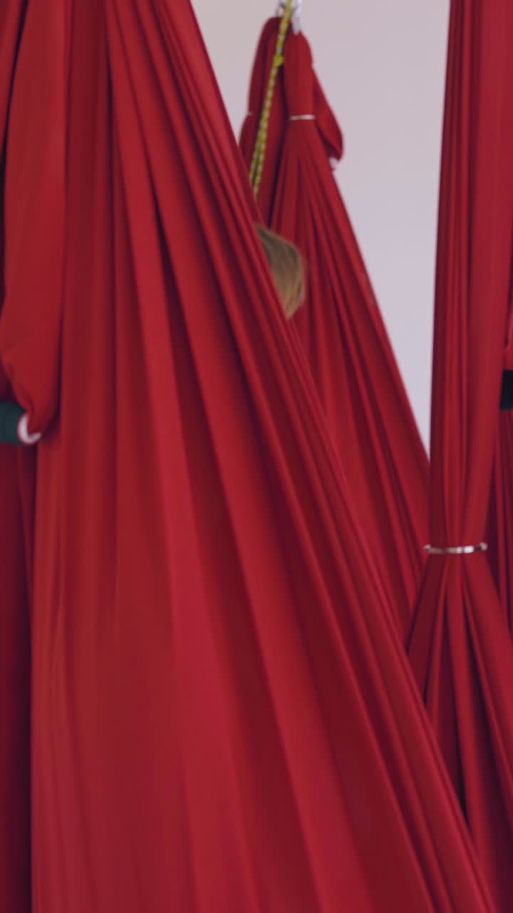 relaxed group of people sleeps and restores energy after advanced fly yoga workout in hammocks close view