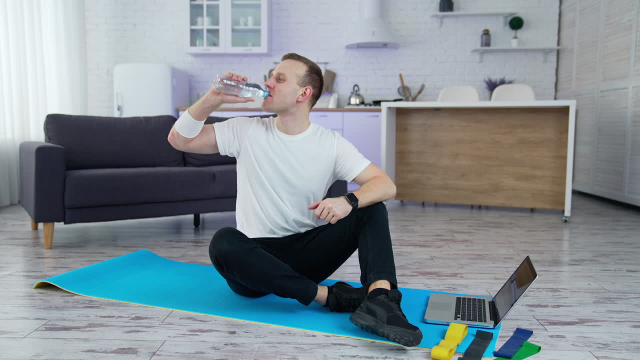 Active lifestyle male doing exercises in home. Quarantine time training indoor.