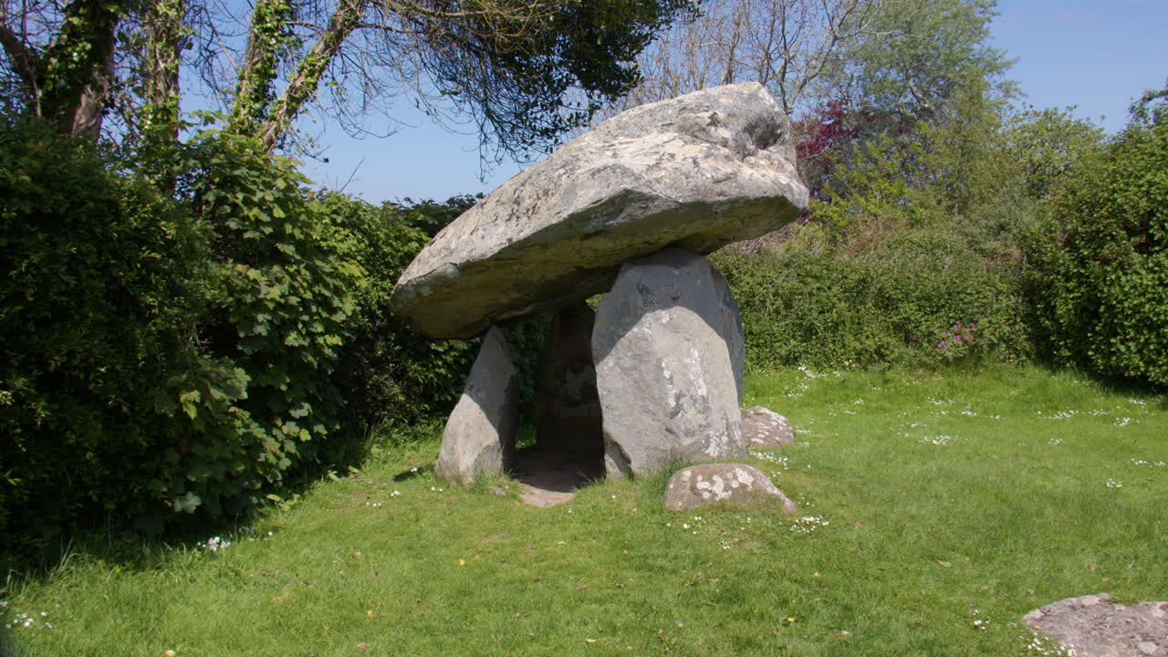 Tilting down Wide shot of Carreg Coetan Arthur Chambered Tomb