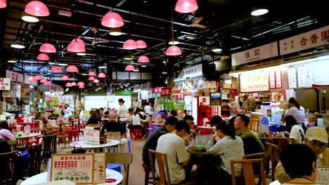 people dining and socializing in a bustling canteen